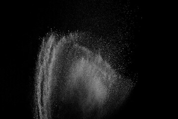 Obraz premium Abstract white dust on black background. Light smoke texture. Powder explosion. Splash water overlay. 