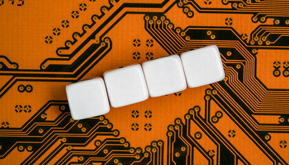 Electronic orange printed circuit board, with four empty white beads small cubes, detail view from...