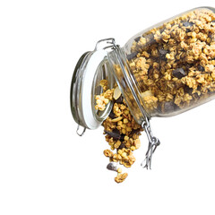 Natural muesli with chocolate falling from the open glass jar on white background
