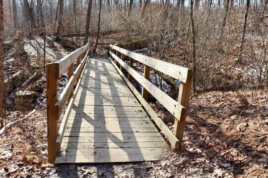 A front view of the old wood bridge on the trail.