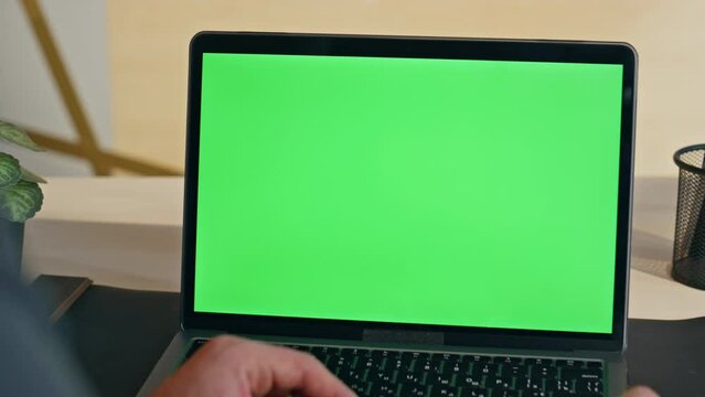 Boss hand swiping touchpad on chromakey laptop starting lesson at home zoom on