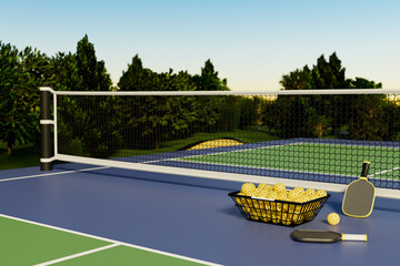 Pickleball rackets and balls in a basket against the backdrop of a court with a net outdoors in a...