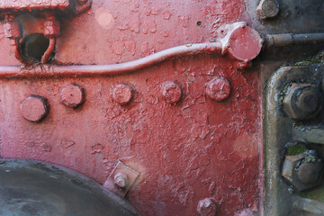 A fragment of the side of an old abandoned steam locomotive.