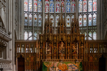 Altar and stained glass in Gloucester cathedral, Gloucestershire, England