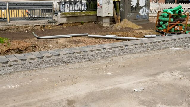 Laying paving stones - road construction site