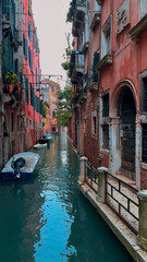 Medieval houses, narrow canals, bridges and gondolas in Venice, Italy, February 10, 2024. - 780803949