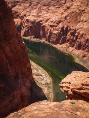 Fototapeta na wymiar Vertical view looking down on Colorado River in Glen Canyon in red sandstone canyon in Page Arizona