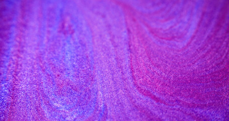 Glitter fluid mix. Wet shimmer texture. Blur purple pink color shiny sand grain particles acrylic...