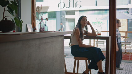 Korean woman resting cafe enjoying cozy atmosphere. Beautiful asian girl waiting