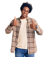 Handsome african american man with afro hair wearing casual clothes and glasses success sign doing...