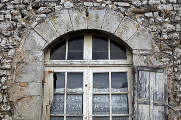 French door and window on a old stone house - Balazuc - Ardeche - France