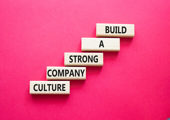 Company culture symbol. Wooden blocks with words Build a strong company culture. Beautiful red...