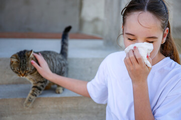 The teenager is allergic to a cat.
