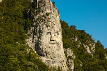 Rock sculpture. Rock sculpture of king Decebal on the bank of Danube River, near the city port of Orsova, Romania.  