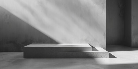 A minimalist black and white photo of a concrete platform. Suitable for architectural and...