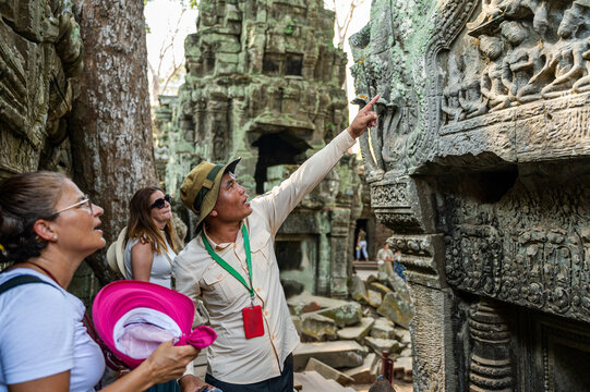 Tour guide explaining history at Angkor Wat