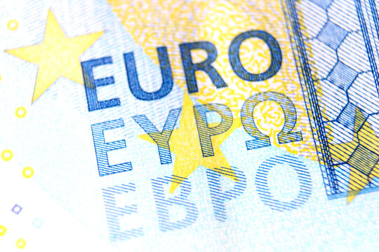 Close-up of a 20 euro banknote fragment with the name of the currency EURO. Macro photography.