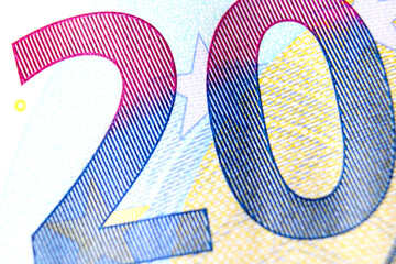 Close-up of a 20 euro banknote fragment on the obverse side, showing the denomination - number 20 ....