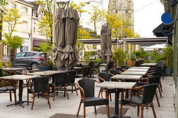 Outdoor Dining Area With Tables, Chairs, and Umbrellas