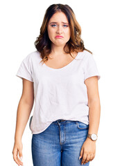 Young beautiful caucasian woman wearing casual white tshirt depressed and worry for distress, crying angry and afraid. sad expression.