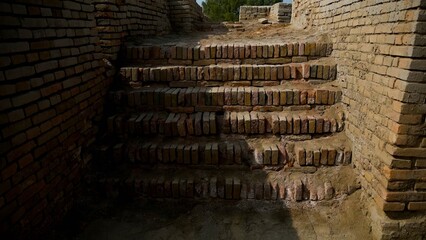 Ancient brick staircase in shadow Mohenjo Daro