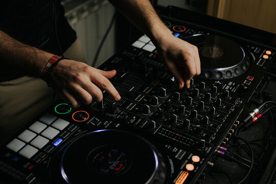 Expert DJ mixing tracks on professional equipment