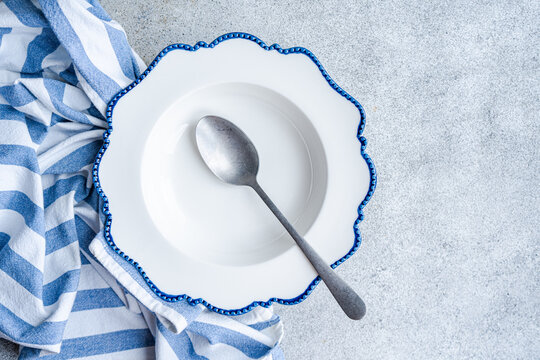 Elegant dining table setup with blue-edged plate