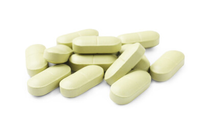 Light green vitamin pills isolated on white