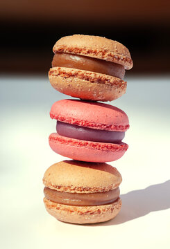 Three colorful macaroons cookies on the table