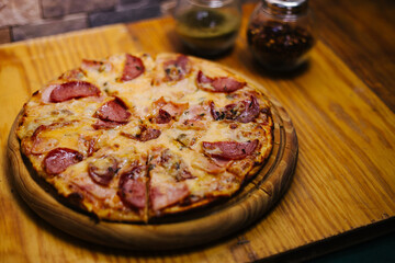 Delicious street pizza with some ingredients at side