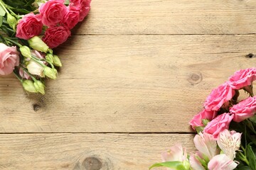 Happy Mother's Day. Beautiful flowers on wooden table, flat lay. Space for text