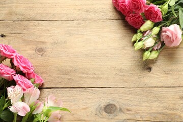 Happy Mother's Day. Beautiful flowers on wooden table, flat lay. Space for text