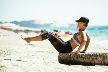 Woman Exercising On The Beach