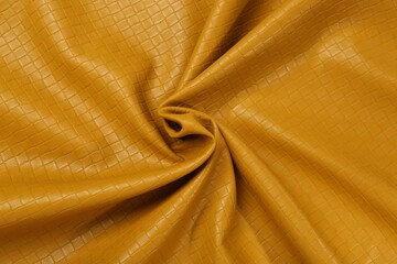 Beautiful yellow leather as background, top view