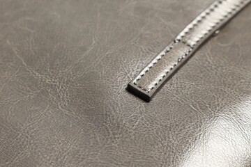 Natural leather with seams as background, closeup view