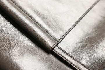 Natural leather with seams as background, closeup