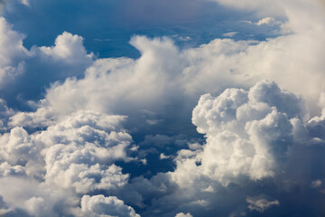 Fototapeta na wymiar Cloudscape with Altocumulus and cumulonimbus clouds from a plane