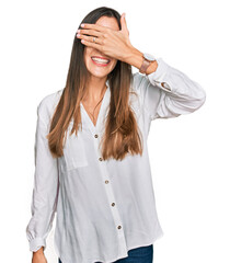 Young beautiful woman wearing casual clothes smiling and laughing with hand on face covering eyes for surprise. blind concept.