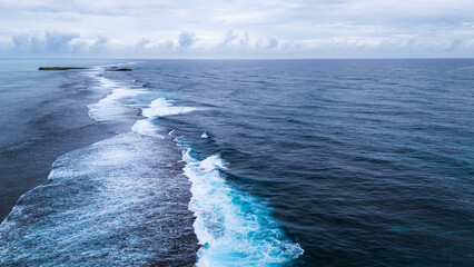 Natural background. A storm on an island in the ocean with a lighthouse.