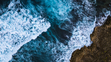 Natural background. A storm on an island in the ocean with a lighthouse.