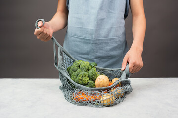 Mesh bag with vegetables, shopping grocery, healthy food ingredients, potato, broccoli and carrots, zero waste
- 780866935