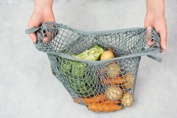 Mesh bag with vegetables, shopping grocery, healthy food ingredients, potato, broccoli and carrots, zero waste
- 780867339