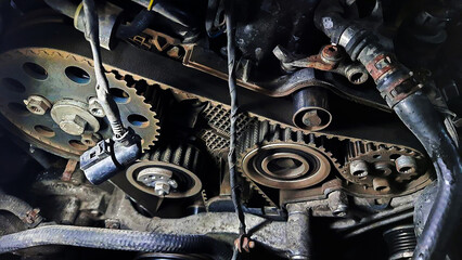Automotive detail, auto mechanic demonstrates auto parts for cars. Car repair. Car repair under the...