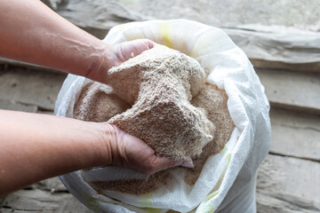 hands full of wholegrain flour