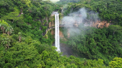 Natural background. A storm on an island in the ocean with a lighthouse.