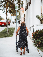old woman walking on the street miami 