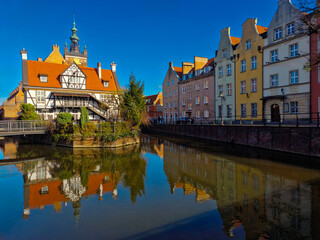 Gdansk, Poland  March 21, 2023: View of the Millers Guild house and the Radunia Canal in Gdansk....