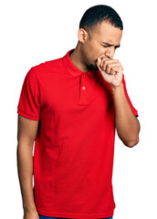 Young african american man wearing casual polo feeling unwell and coughing as symptom for cold or...