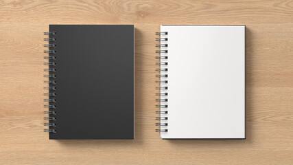 Notebook mockup. Closed and open blank notebook with black cover. Spiral notepad on wooden background