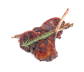 Pieces of delicious grilled beef meat and rosemary isolated on white, top view